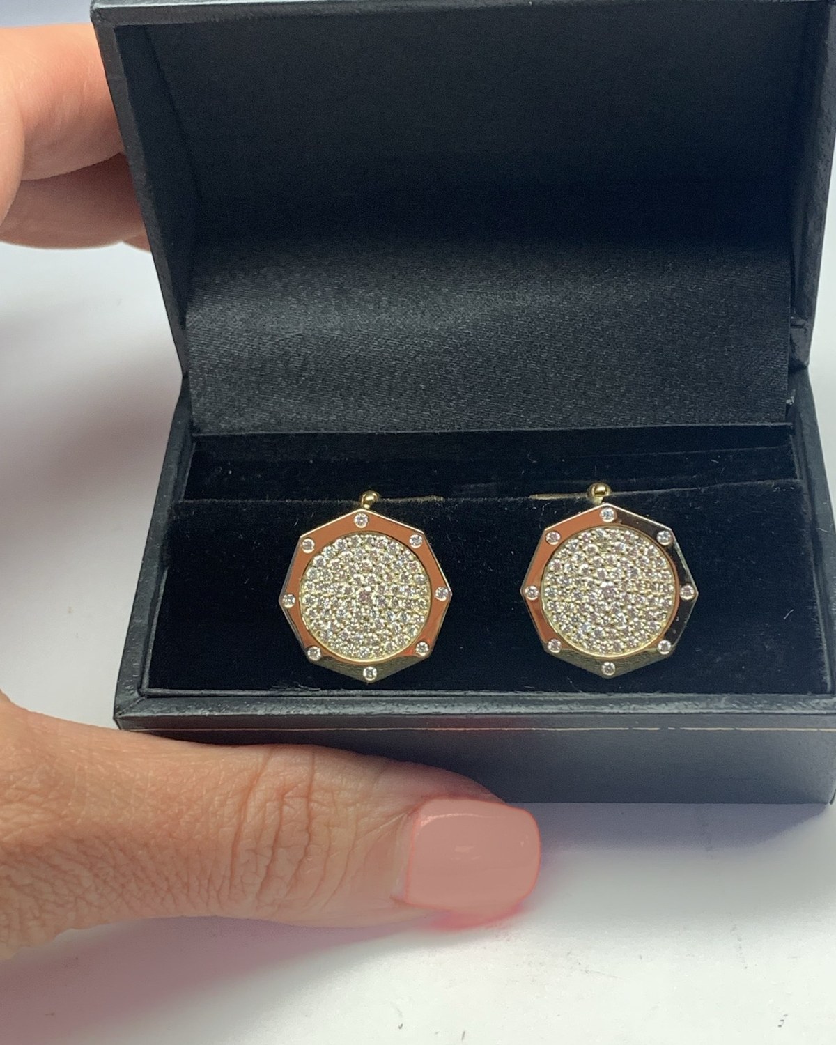 Pair of pavé diamond disc earrings in polished octagonal frames, in their open presentation box