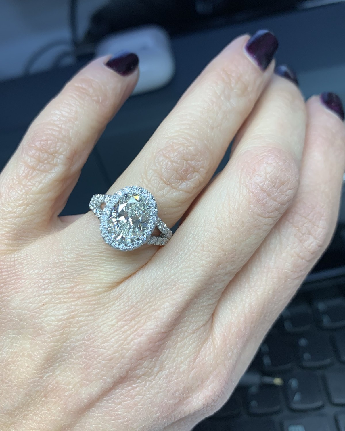 Cushion diamond halo ring on a split shank worn on the hand